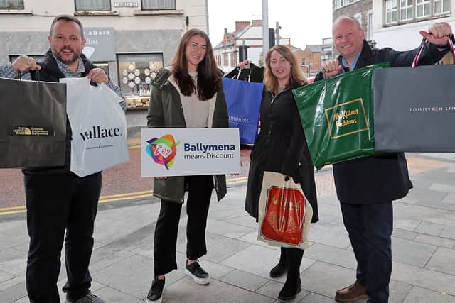 Roy Smyth (Outdoor Adventure), Clare Moore & Emma McCrea (BID) and Hugh Black (Tower Centre) mark the success of Ballymena Discount Day