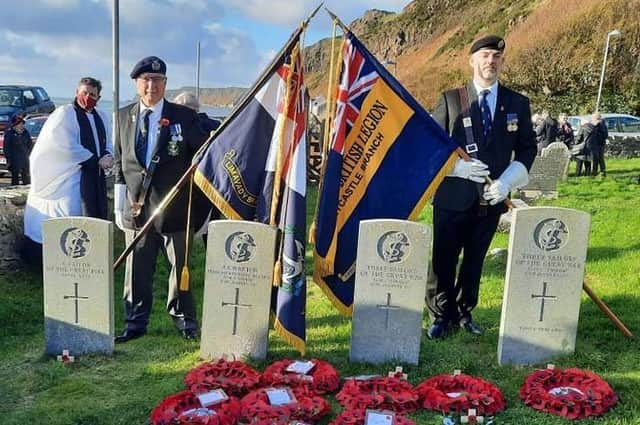 Rev Patrick Barton and standard bearers on Rathlin Island during Remembrance Sunday.