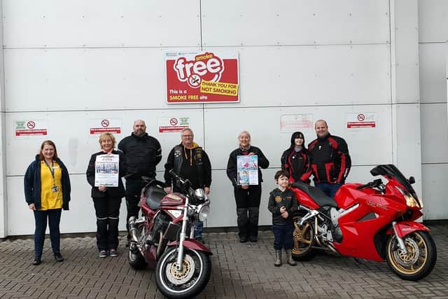 Jenne McDonald, from the Royal Belfast hospital for Sick Children, with members of the Quay Bikers MCC.