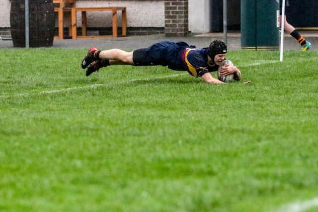 Noah Parks at full stretch as he touches down for Bann U18s' second try