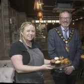 The Mayor, Cllr William McCaughey, with the owners of NACS coffee shop, who recently opened their new business on West Street, Carrrickfergus.