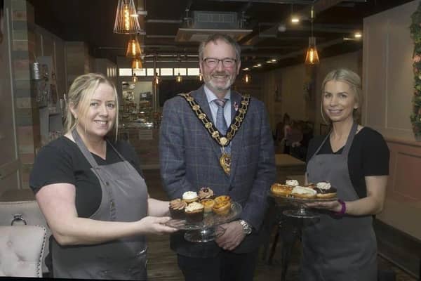 The Mayor, Cllr William McCaughey, with the owners of NACS coffee shop, who recently opened their new business on West Street, Carrrickfergus.