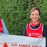 Sinead Rice and Roisin Corrigan with their cheque for £3,685 raised in memory of their brother Fergal,  which was donated to Air Ambulance NI.