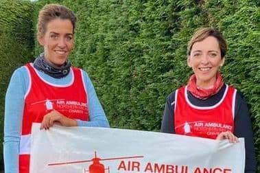 Sinead Rice and Roisin Corrigan with their cheque for £3,685 raised in memory of their brother Fergal,  which was donated to Air Ambulance NI.