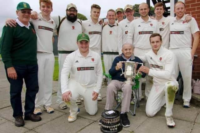 Cecil Walker MBE pictured with the club. Picture courtesy of Lisburn Cricket Club
