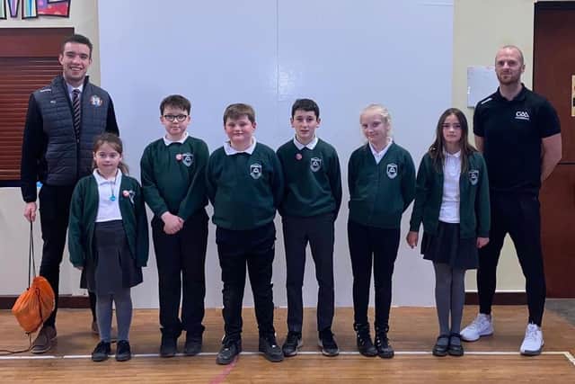 Pictured are P7 representatives of the School Council who will share their understanding of handball throughout the school. Also featured are teacher Mr Ruaidhri Quinn (left) and Darragh  Daly (right)