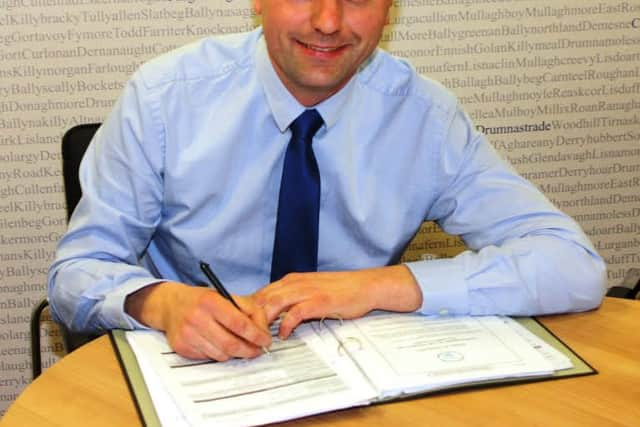 Keith Buchanan DUP candidate for Torrent signing his nomination papers ahead of the forthcoming elections