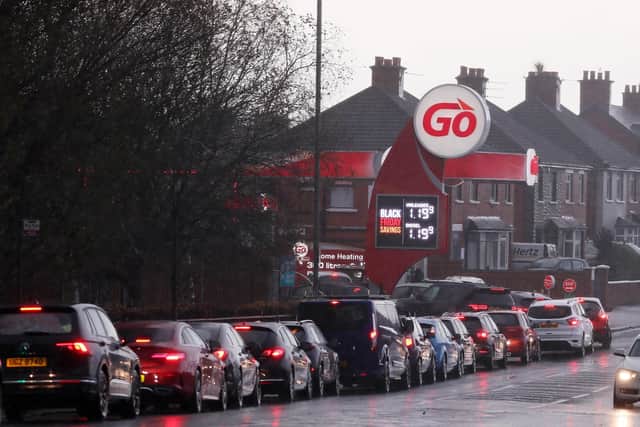 Car owners queue at the GO Garage on Grand Parade, east Belfast, to take advantage of the Black Friday fuel prices. Picture by Jonathan Porter/PressEye