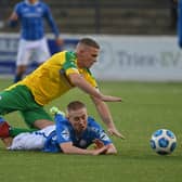 Cliftonville's Levi Ives tussles with Coleraine's Conor McKendry
