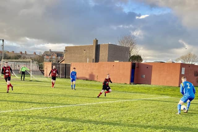 Carryduff Colts’ Joe Sweeney shapes to cross