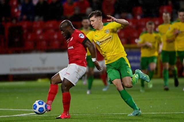 Fuad Sule and Paul O'Neill battle for the ball