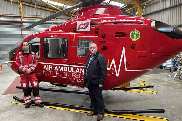 Helicopter Emergency Medical Service Dr Andrew Johnston with Grand Opera House Chief Executive Ian Wilson