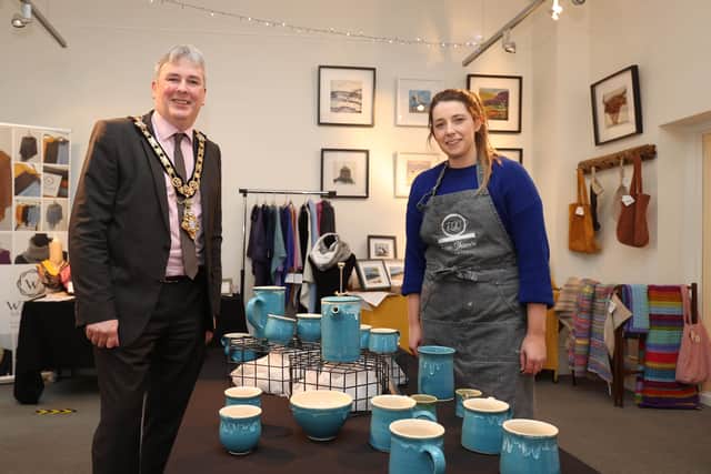 The Mayor of Causeway Coast and Glens Borough Council, Councillor Richard Holmes pictured with ceramic artist Fiona Shannon at Flowerfield Arts Centre’s popular Christmas Craft Market