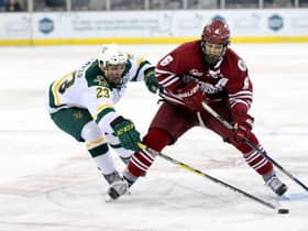 Vermont Catamounts' Rob Darrar with UMass Minutemen's Dominic Trento during Friendship Four game at the SSE Arena, Belfast in 2016