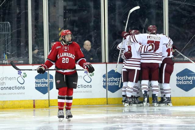 UMass Minutemen's Austin Plevy celebrates scoring against St Lawrence Saints during the Friendship Four 3rd place game at the SSE Arena, Belfast in 2016