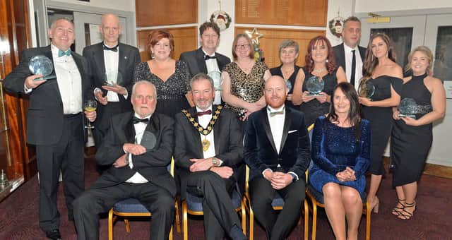 The main prizewinners and sponsors at the Carrick Business Excellence awards including front row from left, Bob Harper, Lifetime Achievement Award winner,  Mayor, Councillor William McCaughey from principal sponsor Mid & East Antrim Borough Council, compere, Barra Best and Jenny Small, VP of Performance and Development Northern Regional College.  Also included third, back row, is Kelli McRoberts, manager with category sponsors Carrickfergus Enterprise.  INCT49-209.