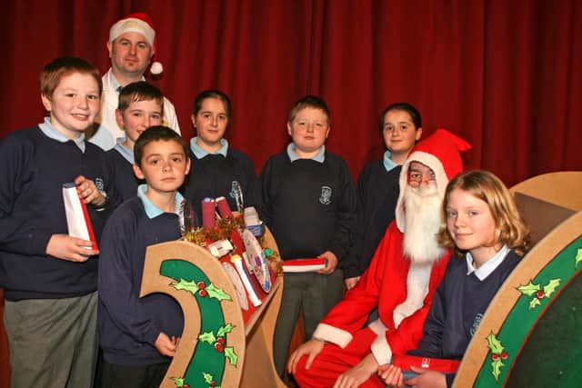 Pupils from Kirkinriola PS who won the "Design a dashboard for Santa's sleigh" competition, organised by Dunclug College Technology and Design Department for local Primary Schools. Included is Peter Simpson (Head of Department). BT52-224AC