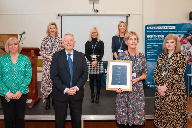 Course Promotion of the Year Award Winner - Inclusive Learning Team (Jennifer McFadden, David Stewart, Rhonda Brady, Claire Wilson, Meabh O'Reilly, Elaine Macauley, Fiona Forrest, Kiera O'Kane, Angela O'Neill, Vivien Carson, Hilary Caithness, David Dickey, Sandra Hamilton, Anne Marie McKenna, Jacqueline Wilson) with Bill McCluggage
