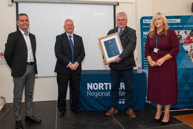 Representatives of the team, Frankie McEldowney, Donal MacAuley and Fiona Forrest are pictured with Bill McCluggage, Chair of Audit and Risk Committee