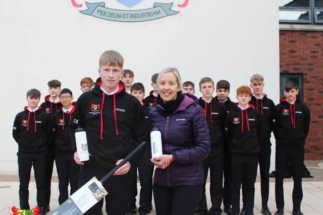 Second XI captain Charlie Keery with his 2nd XI as they receive training hoodies from Emer Lavery (EMTEK Ireland) as part of their preparations for the Prior Shield quarter final against CCB in 2022