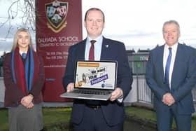 Pictured left to right are Zara Thorpe, Head Girl at Dalriada School, Economy Minister Gordon Lyons, and Tom Skelton, Principal Dalriada School