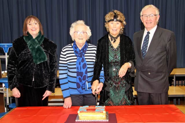 Cutting the 100th Anniversary cake are Mrs Linda Armour, Principal, Loanends Primary School; Mrs Ruth Erwin, Templepatrick; Baroness Hoey of Lylehill and Rathlin; and Mr Richard McCourt, Chairman, Board of Governors.
