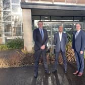 Wrightbus MD, Neil Collins, Wrightbus CEO, Buta Atwal, and FirstMinister Paul Givan outside the Wrightbus factory in Ballymena.