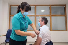 The First Minister received his booster jab from vaccinator Moira Mulholland during the visit. Photo by Jonathan Porter / Press Eye.