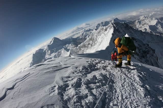 Photo taken on May 17, 2018, as mountaineers make their way to the summit of Mount Everest, as they ascend on the south face from Nepal. Photo by PHUNJO LAMA/AFP via Getty Images