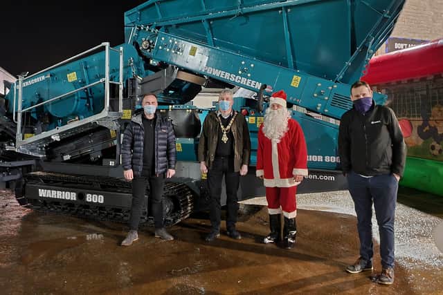 Pictured at Terex Family Fun Night are (from left) Production Manager Mark McKay with Mayor of Causeway Coast and Glens Cllr Richard Holmes, Santa Claus and Plant Manager Jonathan Hanna