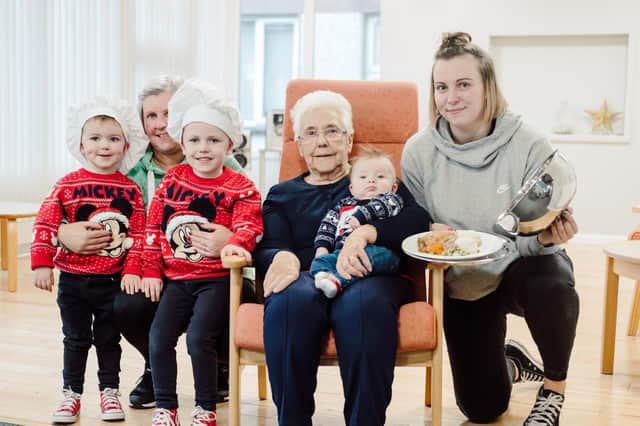 Fergus Fold resident Margaret Lavery launches Radius Housing’s Operation Christmas, where she is joined by her daughter, Linda Hartley; great-grand children, Mason (4) and Jude (2) Fittis; her granddaughter Carolyn Hartley, and 3 month old Zion McClatchey.