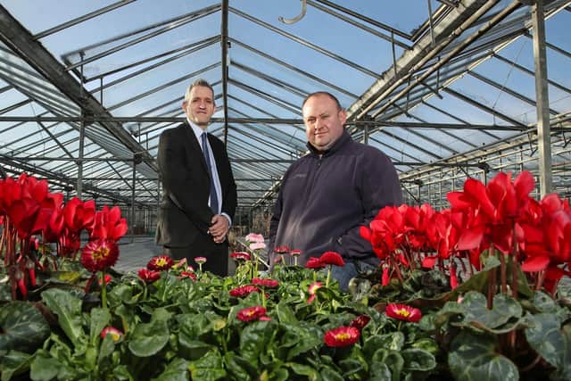 Ulster Bank business development manager Paul Reid (left) pictured with Wilderness Flower & Garden Centre owner Kyle Archer.