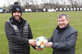 Former Rathfriland player Stephen McAlinden presents a match ball to chairman Adrian Megaw