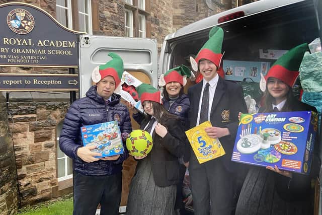 Getting the Belfast Royal Academy minibus loaded up with gifts donated to this year's toy appeal.