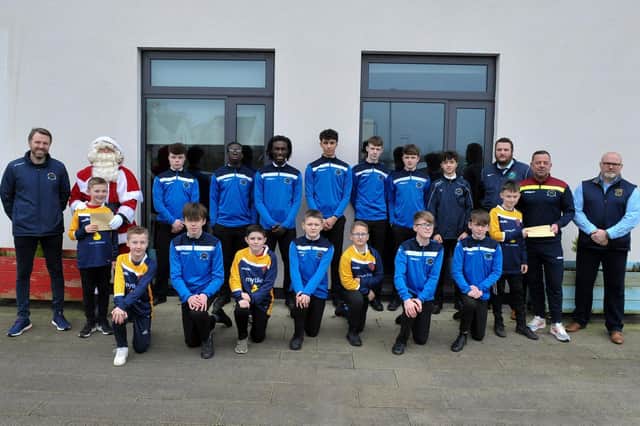 Pupils from Ebrington Primary School and young footballers from Institute FC’s academy pictured at the school on Wednesday morning a visit by club officials to distribute free tickets to Institute’s home games against Ballinamallard United tomorrow and Newry City on Saturday, January 1st 2022. Free tickets, for the games, are being offered to schools around the city. Included, from left, are Gary Forth, Institute’s Youth Development Manager; Santa; Lee Kitson, Institute’s Goalkeeping Coach; Institute First Team Head Coach Brian Donaghey and Mr Brian Guthrie, Principal, Ebrington PS. Picture by George Sweeney