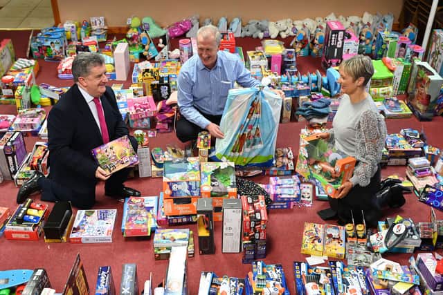 NI Prison Service Director General, Ronnie Armour and Probation Board for Northern Ireland Chief Executive Amanda Stewart are pictured with Robin Scott, Chief Executive of the Prison Fellowship NI, among the many gifts which have been donated by their staff to the Fellowship’s Christmas Hope Appeal which provides much-needed help for the families and children of those in prison