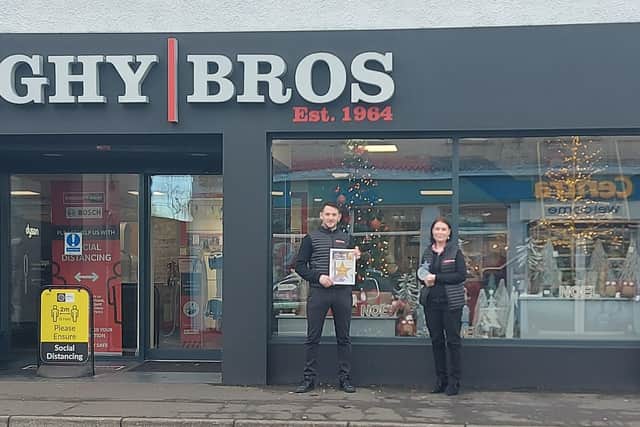 JP McAllister & Emma Begley from Donaghy Bros, winners of the Best Dressed Christmas Window in Kilrea