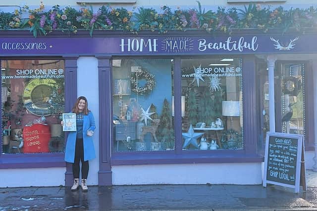 Tracey McAllister pictured with her prize after Home Made Beautiful won the Best Dressed Christmas Window in Ballycastle