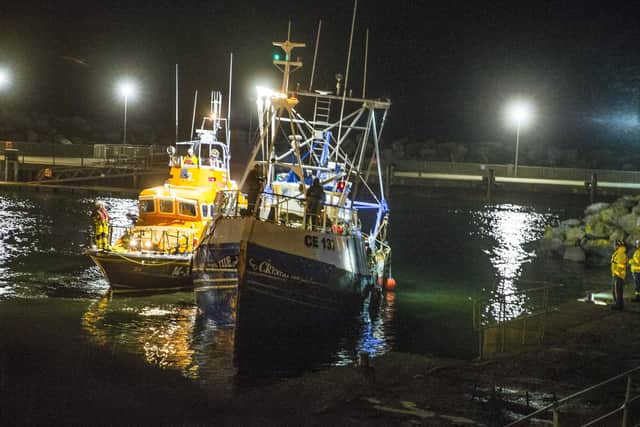 Red Bay life boat brings Trawler Crystal Tide into Ballycastle Harbour. Pic Kevin McAuley/McAuley Multimedia