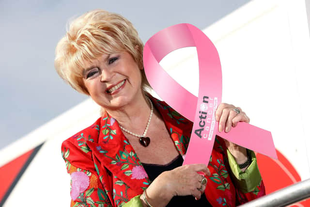 Act Now - Breast Aware & Self Refer
Tying her gift up in a ribbon:  Gloria Hunniford flew in to Belfast to catch up on Action Cancer's Breast Screening service and personally support the charity's Breast Cancer Awareness Campaign.  The Caron Keating Foundation - set up in memory of Gloria’s daughter - has donated funds to support a radiographer on Action Cancer’s Big Bus over several years. Gloria has a long standing association with Action Cancer's breast screening, the only charity offering screening to women who are aged 40-49 and over 70 who fall outside the NHS Screening age.