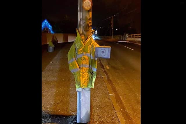 Lampost in Banbridge dressed up as a 'police officer' armed with a 'speed gun'.