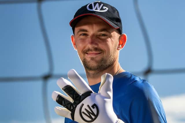 Nelson Suburbs FC goalkeeper Corey Wilson models his new keeper glove range, which are now on sale. Picture by Tim Cuff