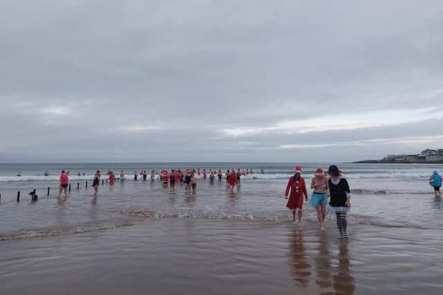 The Seabirds' Christmas Eve dip in aid of the Olive Branch attracted great support