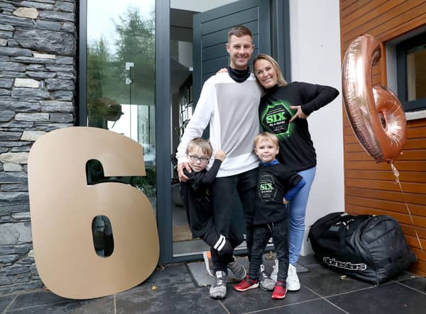 Jonathan Rea has been awarded the OBE in the New Year's Honours. He is pictured here on his return home from being crowned the  World Superbike champion for the sixth time in 2020 with his sons Jake and Tyler and wife Tatia. Picture: Stephen Davison.