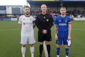 Rathfriland FC captain Ross Black and Derriaghy CC captain with referee before kick off