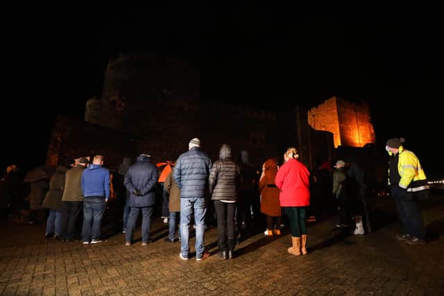 Friends and relatives of Glenn Quinn take part in a vigil at Carrickfergus Castle on the 2nd anniversary of his murder.

Photo by Kelvin Boyes / Press Eye.
