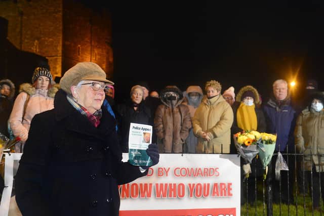 Glenn Quinn's mother Ellen pictured with family and supporters beside a new banner after the vigil.
  Picture By: Arthur Allison/Pacemaker Press.
