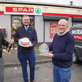 Ciaran Haren and Justin Hayes from Henderson Group present A commemorative plaque from SPAR NI to celebrate 50 years of business with owner James McCracken from McCrackens SPAR in Portadown.