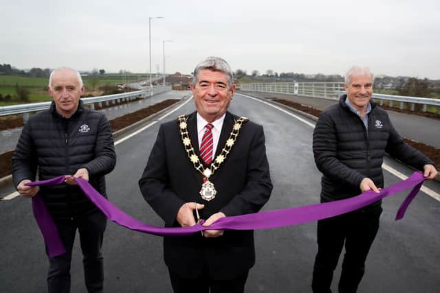 Ciaran Murdock, chief executive of the Lotus Group and Paul O’Rourke, managing director of Lotus Homes, are joined by the Mayor of Antrim and Newtownabbey, Cllr Billy Webb, to officially open the first phase of the Ballyclare Western Relief Road.