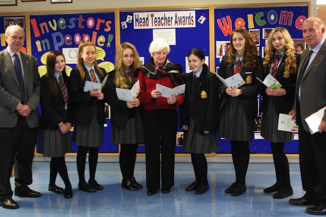 Mary Sinnamon (centre) and fellow Rotarians with Downshire School pupils involved in a Rotary project a number of years ago. INCT 46-706-CON